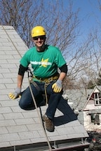 Brian Flechsig Owner Operator Denver Gutter Cleaning roped off on a roof